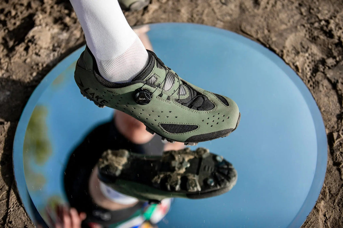 Riders on a gravel road wearing Lake cycling shoes
