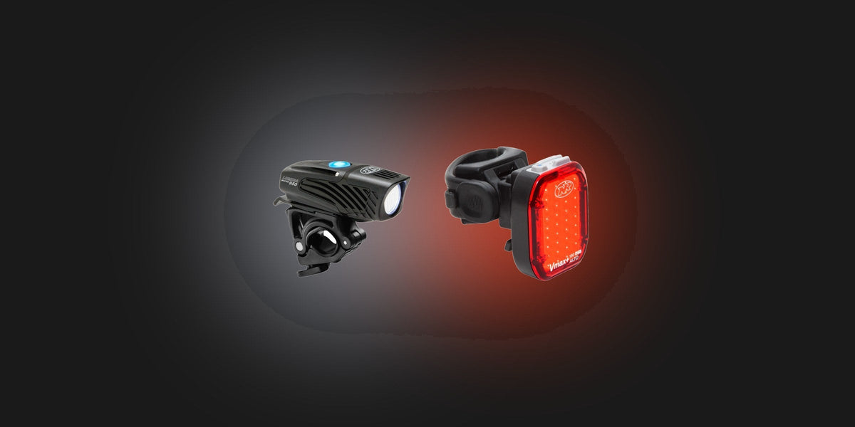 NiteRider headlight and red tail light glowing against a dark background