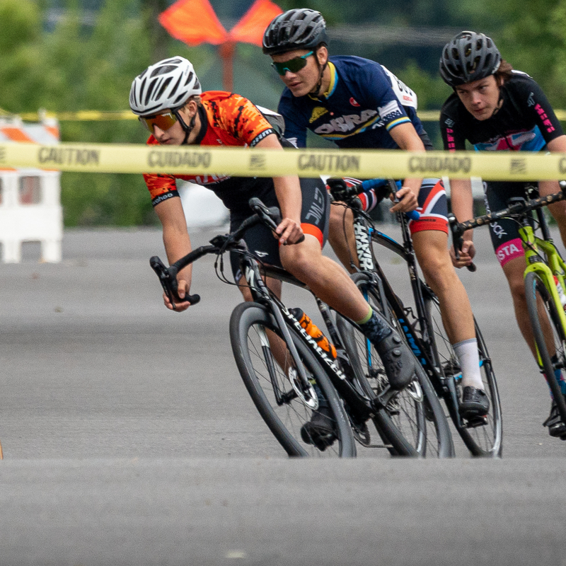 Dialed junior leading a corner in a road race