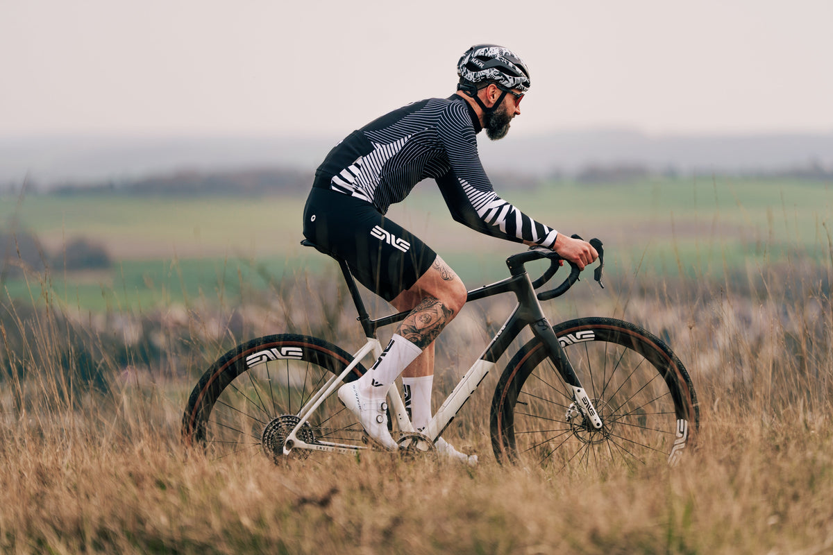 Rider on an ENVE MOG gravel bike riding through tall grass