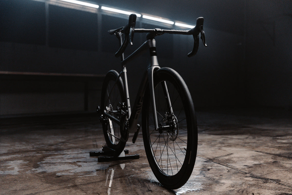 ENVE carbon road bike standing in a dark concrete room
