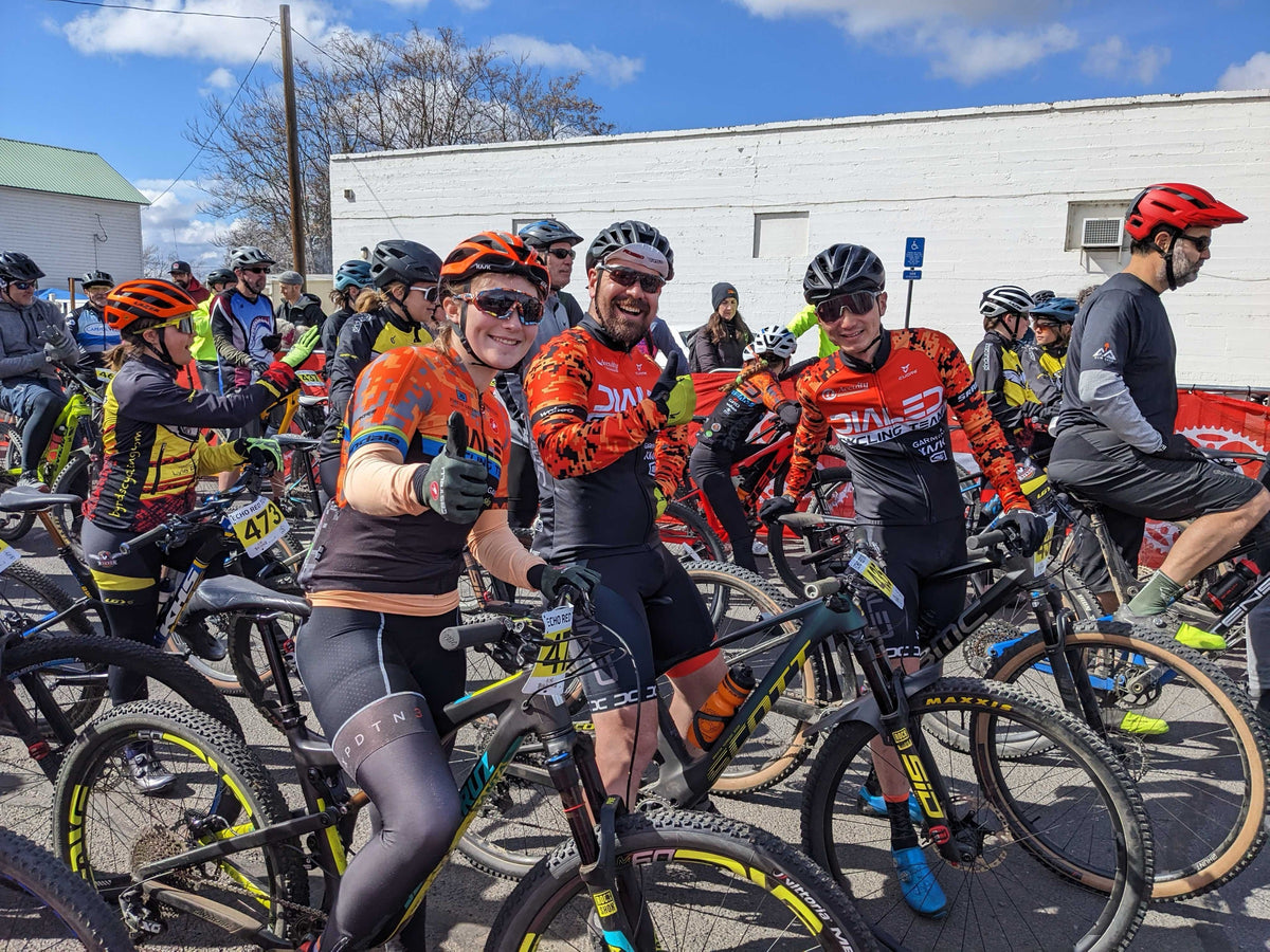 Dialed Cycling Team riders lined up together at the start of a mountain bike race